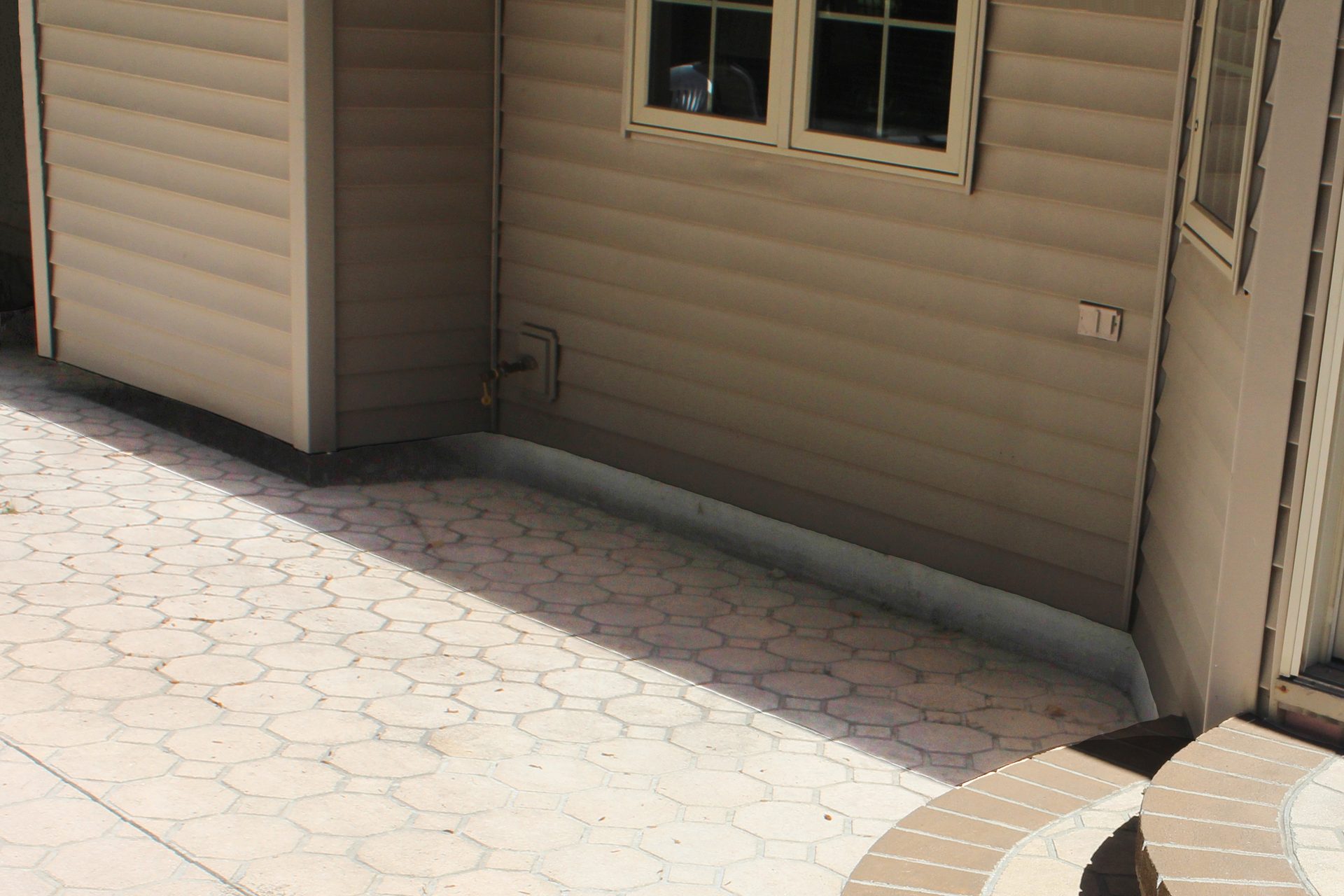 Sunken garage threshold slab before polyurethane foam lifting Utah County